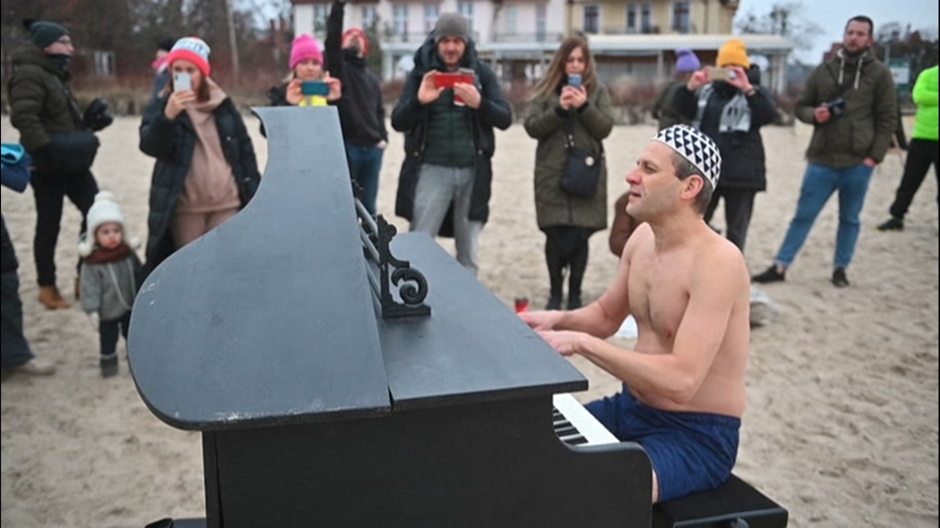As swimmers leaped into a frigid Baltic Sea on Feb. 28, pianist Tomasz Szwielnik performed in just a bathing suit to raise money for a young man's medical costs.