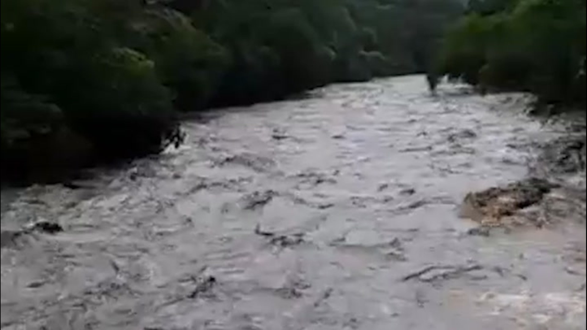 The San Jose River overflowed near Chiquimula, Guatemala, on May 31, resulting in a dangerous, fast-flowing current.
