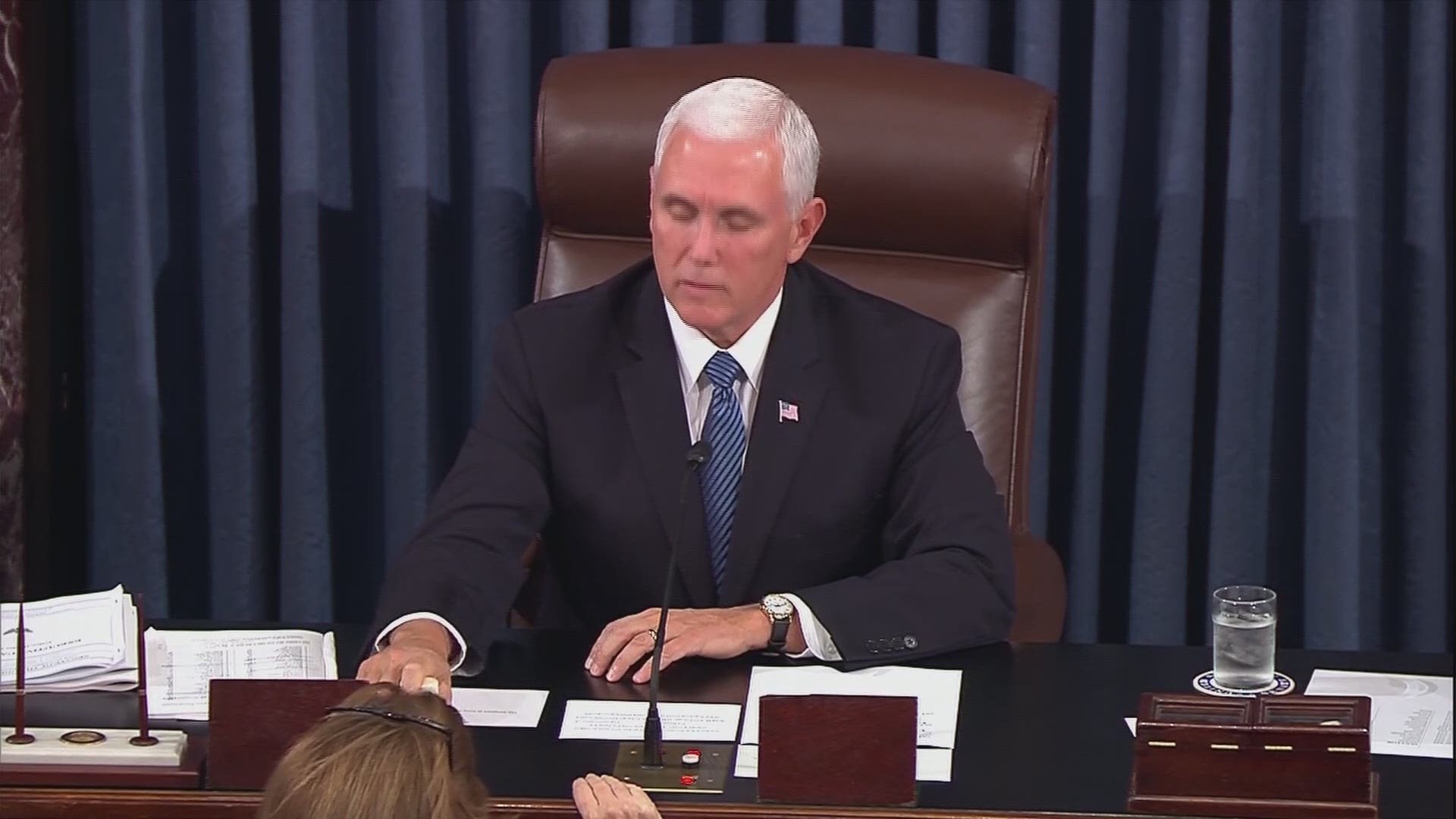 Before Vice President Pence called for the first vote, protesters began angrily yelling and were dragged out of the chamber by police.