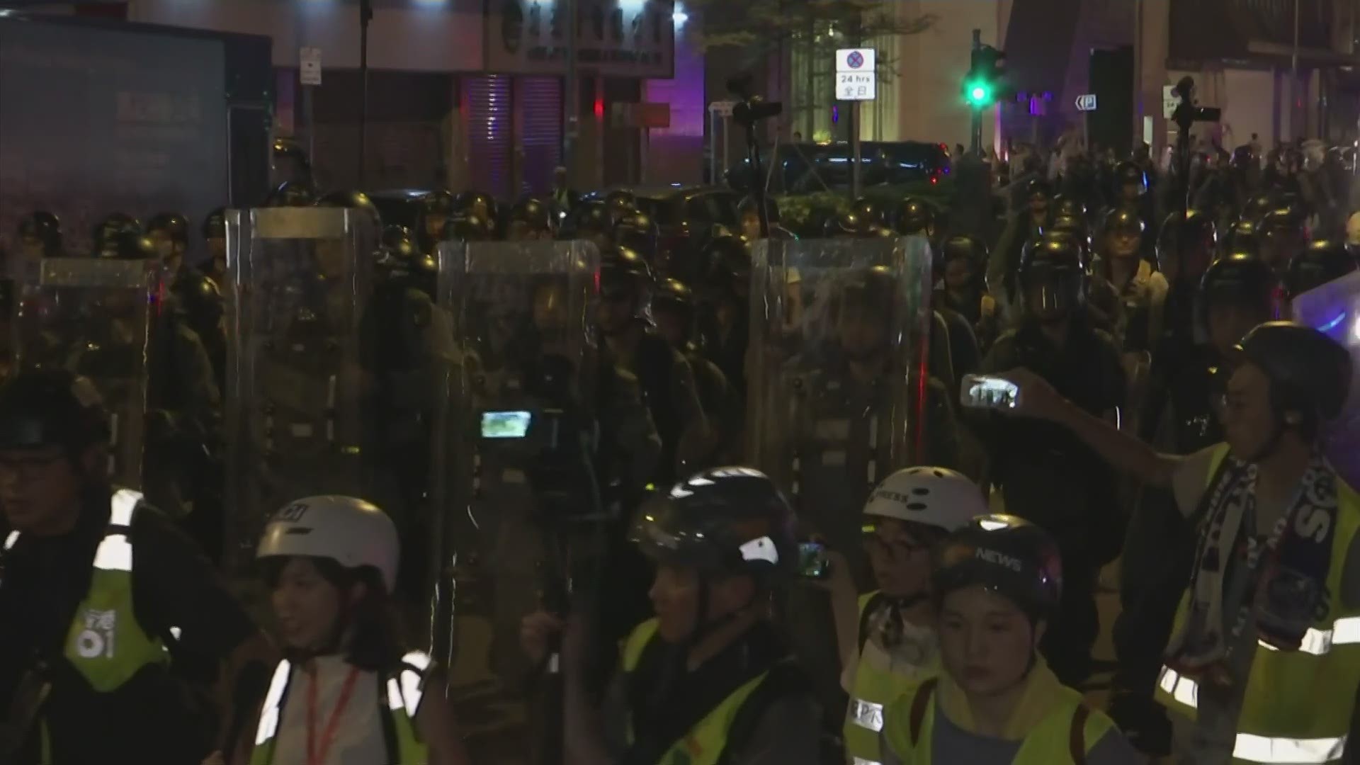 Police lined up on Kong Kong's streets on Sunday as tens of thousands marched in another anti-government demonstration, this time principally calling for an independent investigation into police tactics used during previous protests.