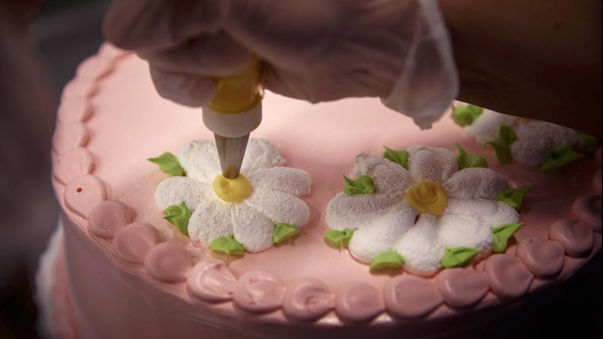 Walmart's 6,200-strong army of icing artisans are the company's highest paid hourly workers, excluding store managers.