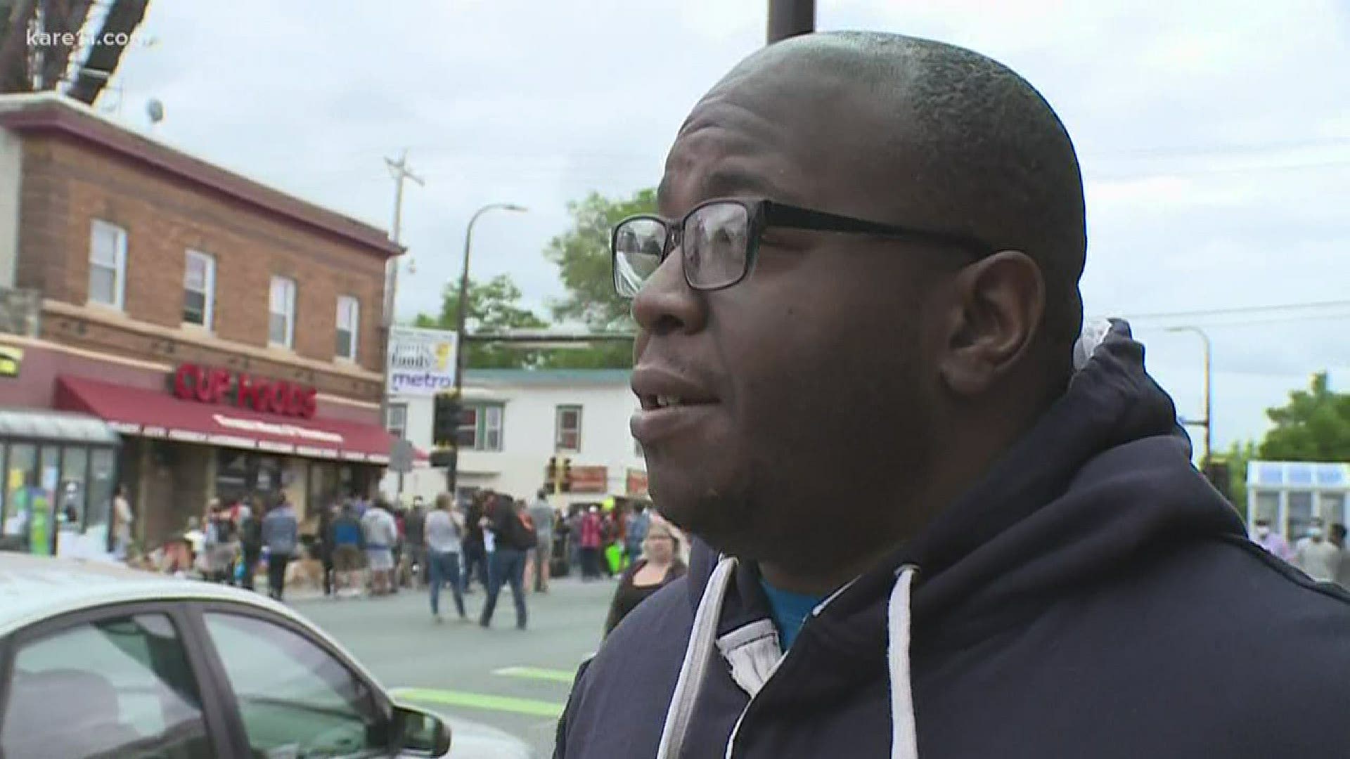 People near Cup Foods in Minneapolis react to the charges against former Minneapolis police officer following George Floyd’s death.