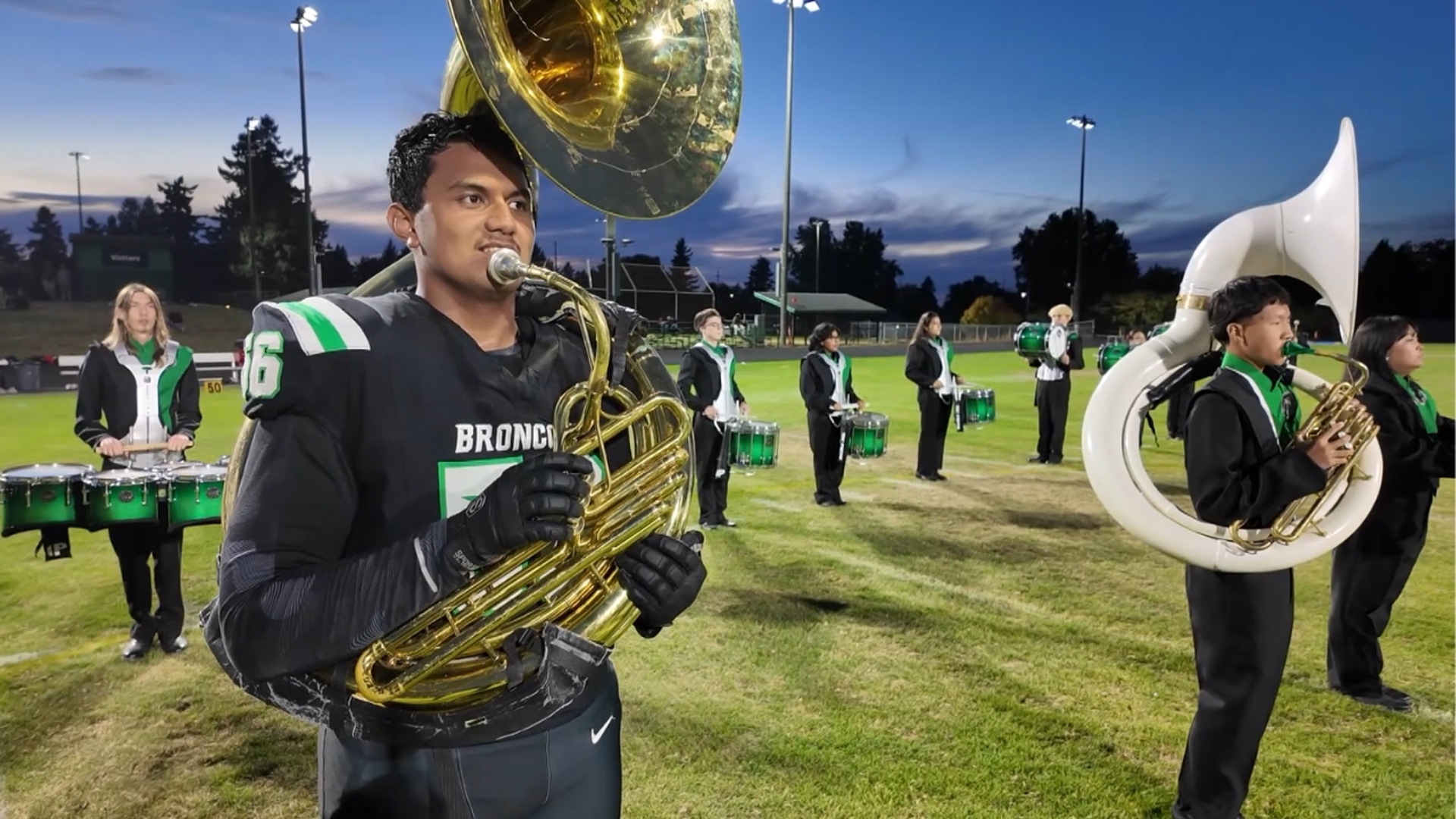 Parkrose High senior Juni Napaa takes the spotlight both on the football field and at halftime with the marching band.