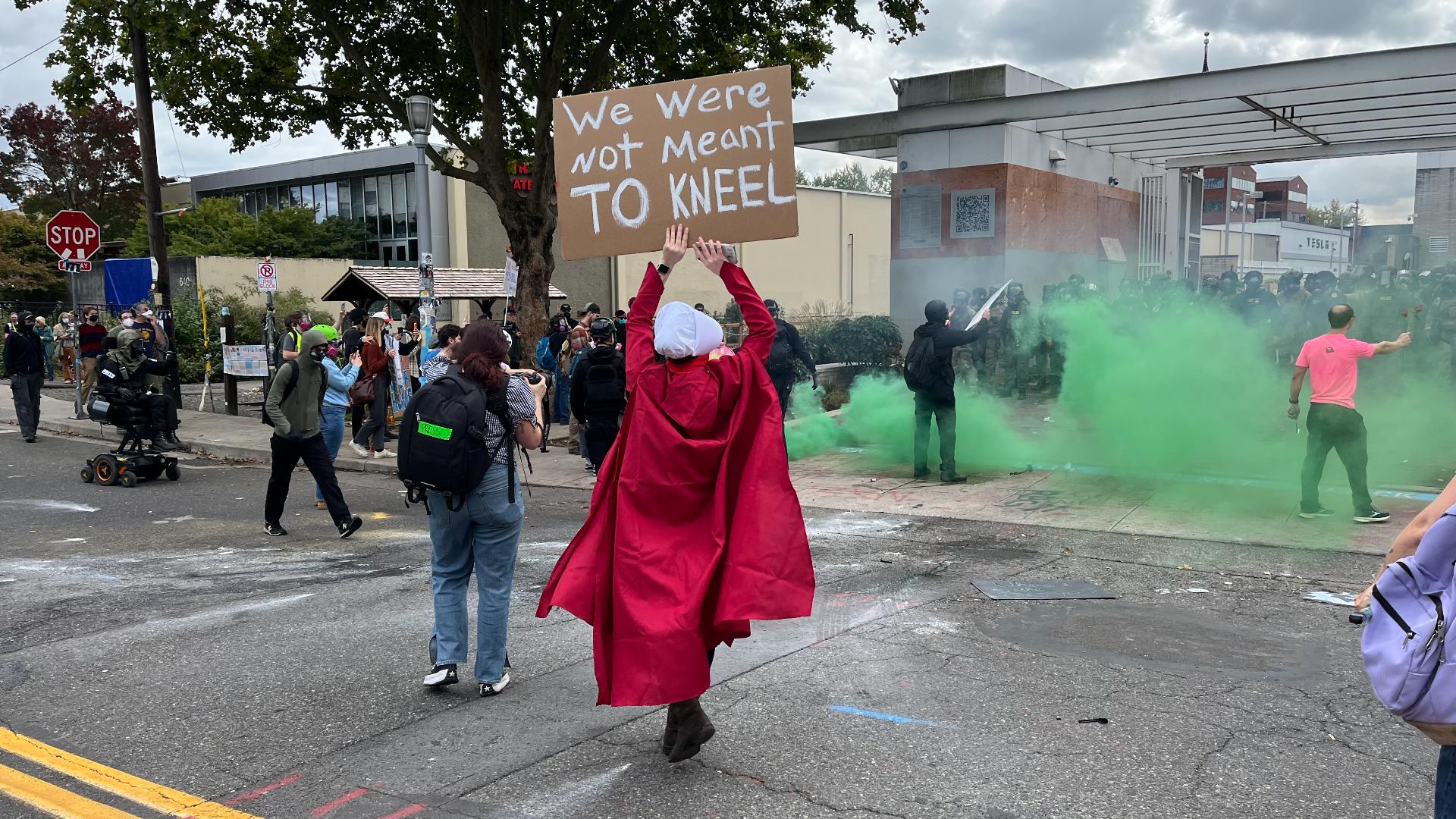 Protesters marched down to the ICE facility Friday and were quickly met with force from federal agents, with at least three people detained.