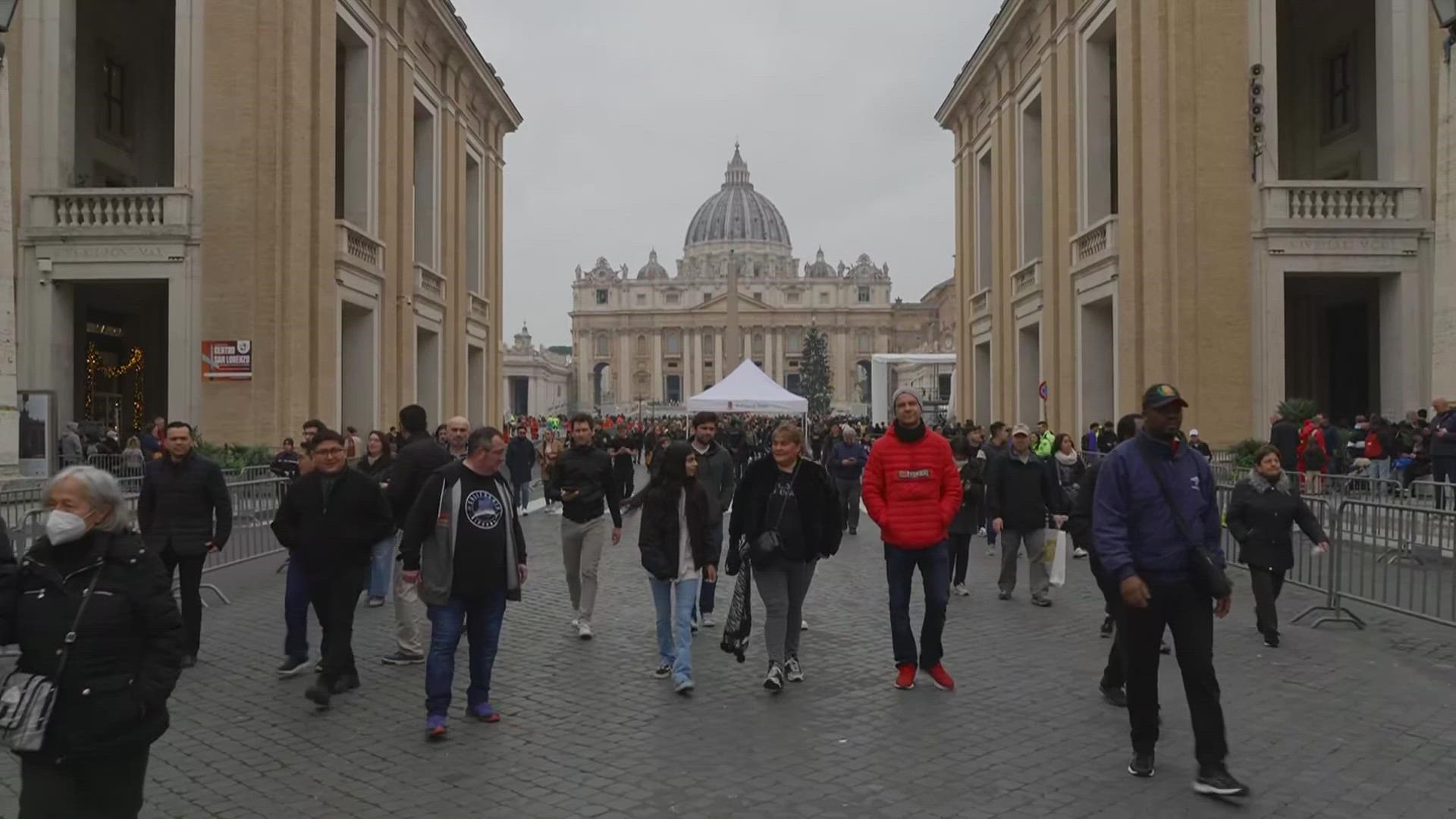 People line up to enter Saint Peter's Basilica at the Vatican where late Pope Benedict 16 is being laid in state at The Vatican.