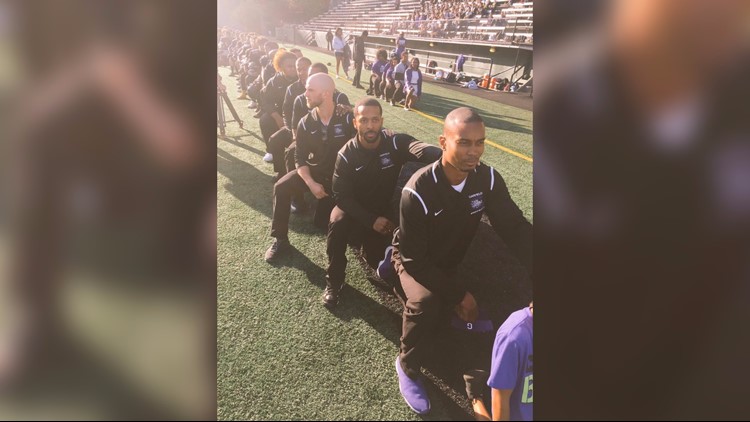 Garfield High football continues protest, kneels during Pledge of Allegiance