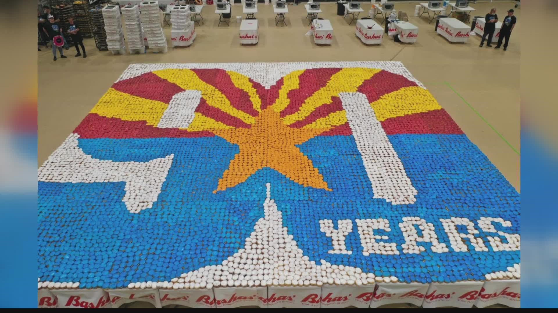 Bashas' is celebrating 90 years by going for the Guinness World Record for the largest donut mosaic. Bashas' workers built a 900 sq foot mosaic made with donuts!