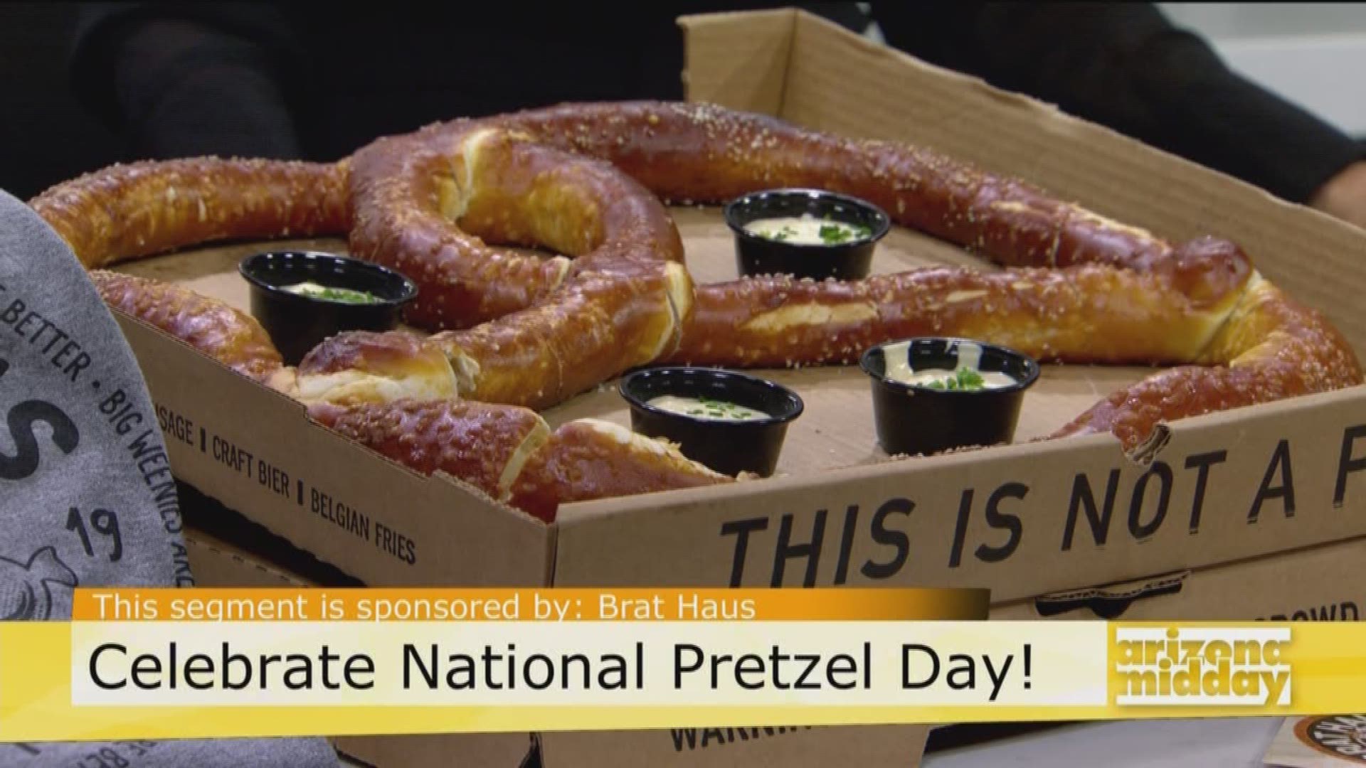 Chad Black with Brat Haus is showing us the delicious pretzels for the best national pretzel day celebration