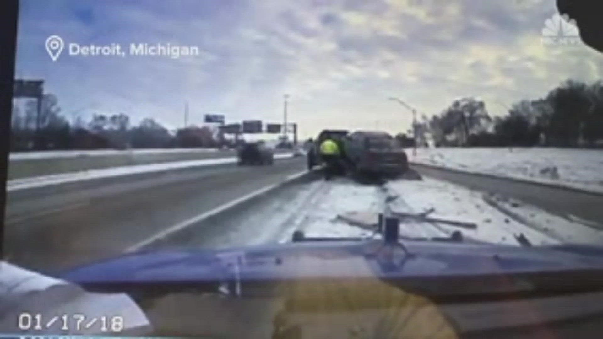 Michigan State Police dashcam showed a truck operator running to avoid being hit by a car.
