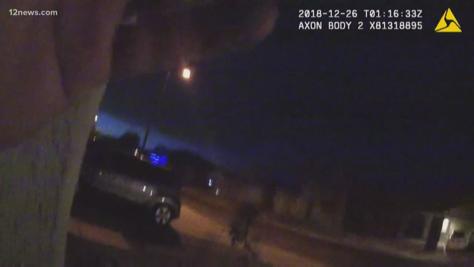 Video shows a man opening fire on Buckeye police on Christmas last year. Police surrounded the home after the man's girlfriend said he was armed and "acting crazy."
