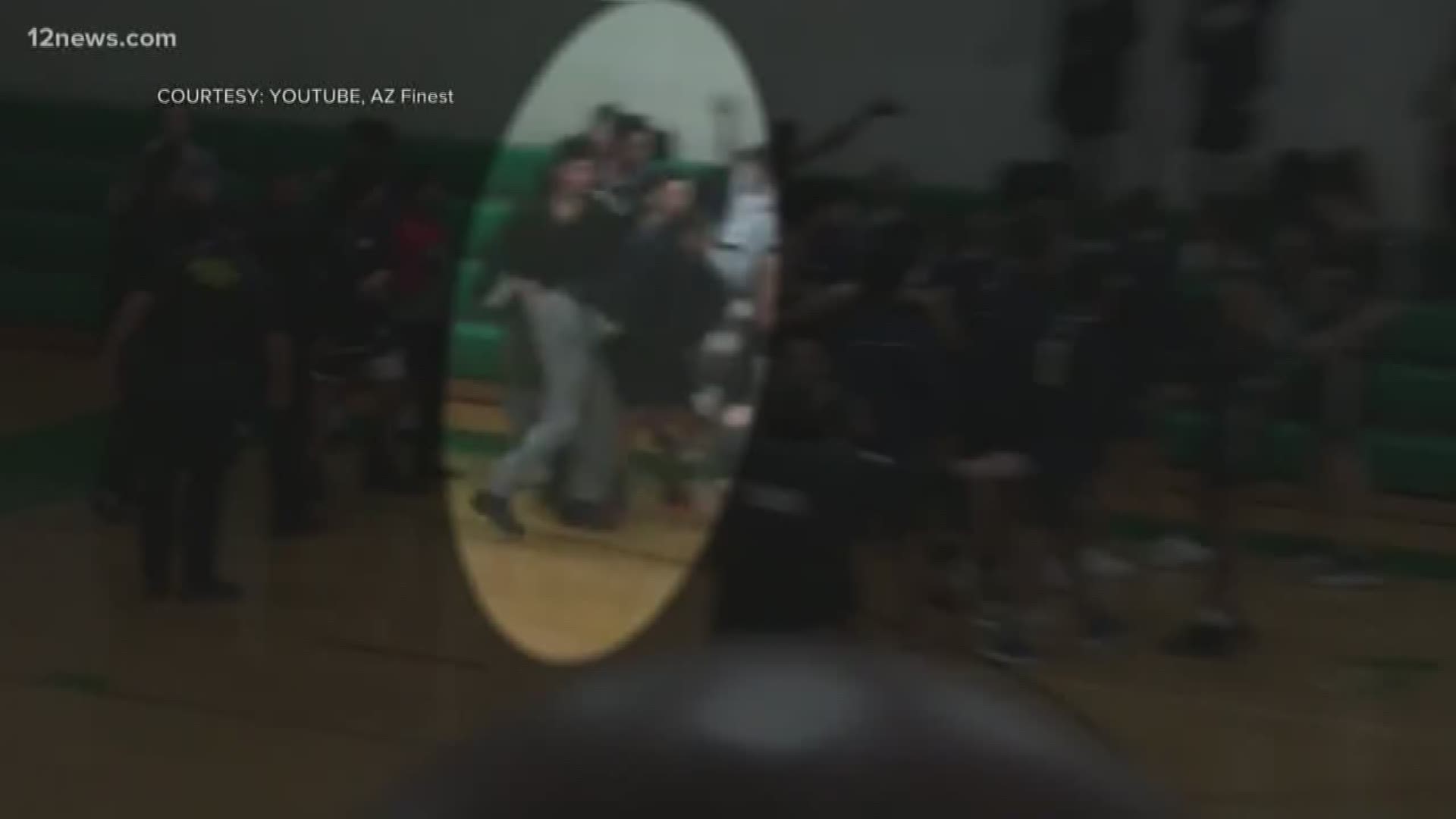 A Valley mom wants to make sure a high school coach keeps his job after he was caught on camera shoving and grabbing a basketball player
