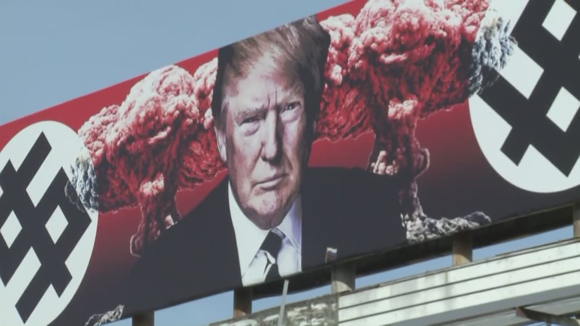 A President Trump billboard is near 11th and Grand Avenue, sparking controversy.