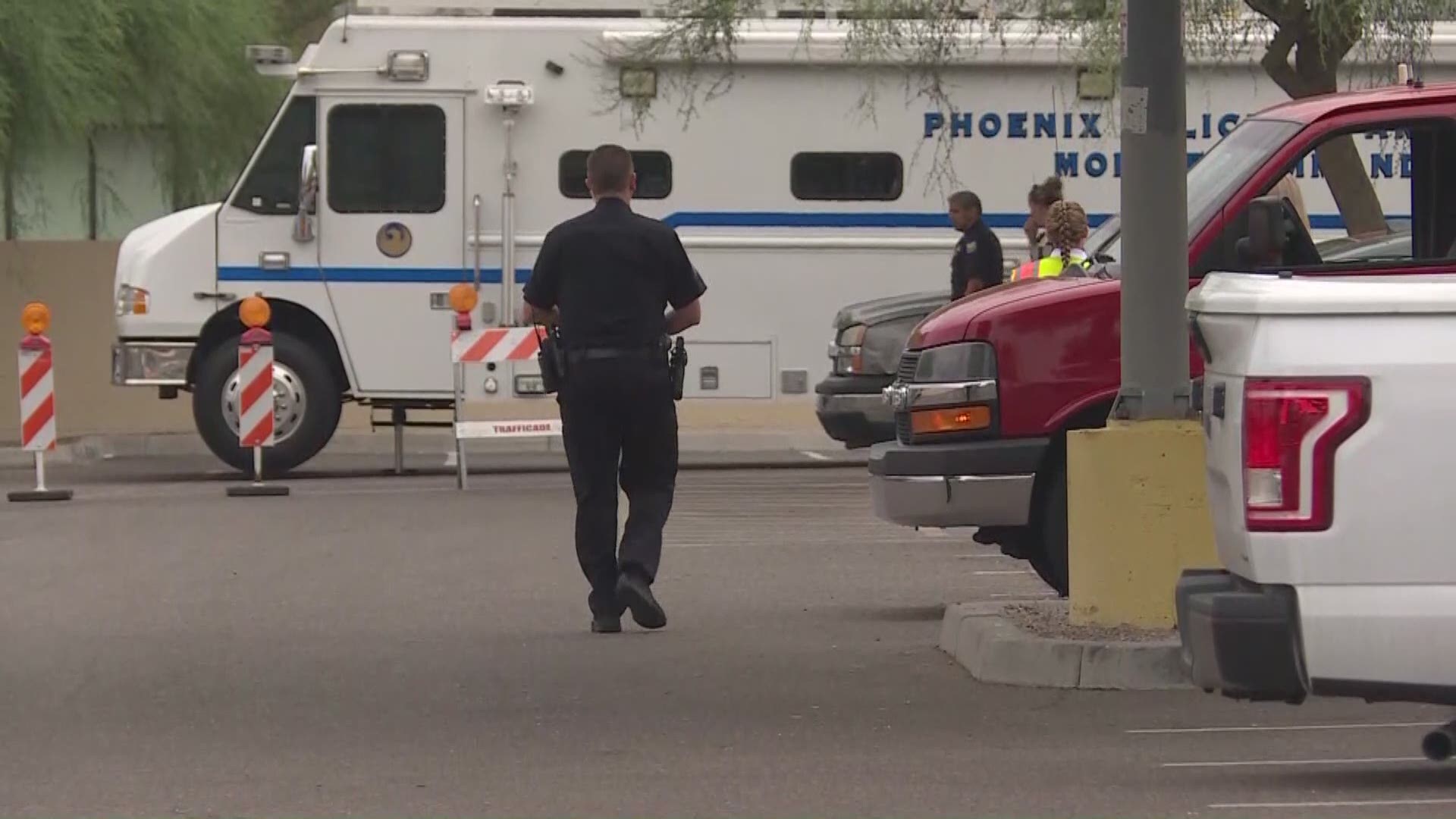 Police say a man died after exchanging gunfire with police. The suspect was hit by a bullet, then hit by traffic on a freeway off ramp in downtown Phoenix.