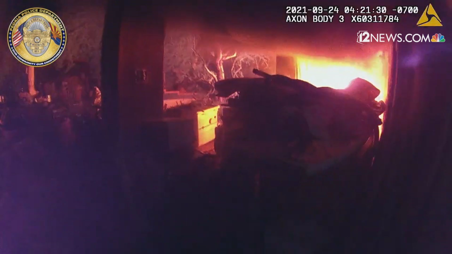 Peoria Police Officer Kyle Trouton's body camera captured the moment he helped a man escape a house fire from a second-story balcony. Both men were fine.