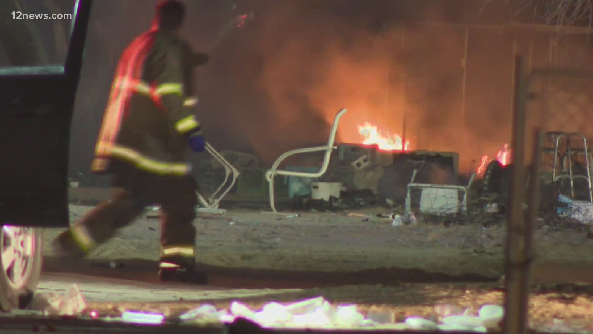 Two people were rushed to a hospital with severe injuries after they were found inside a rural Maricopa County home that authorities say was lit on fire.