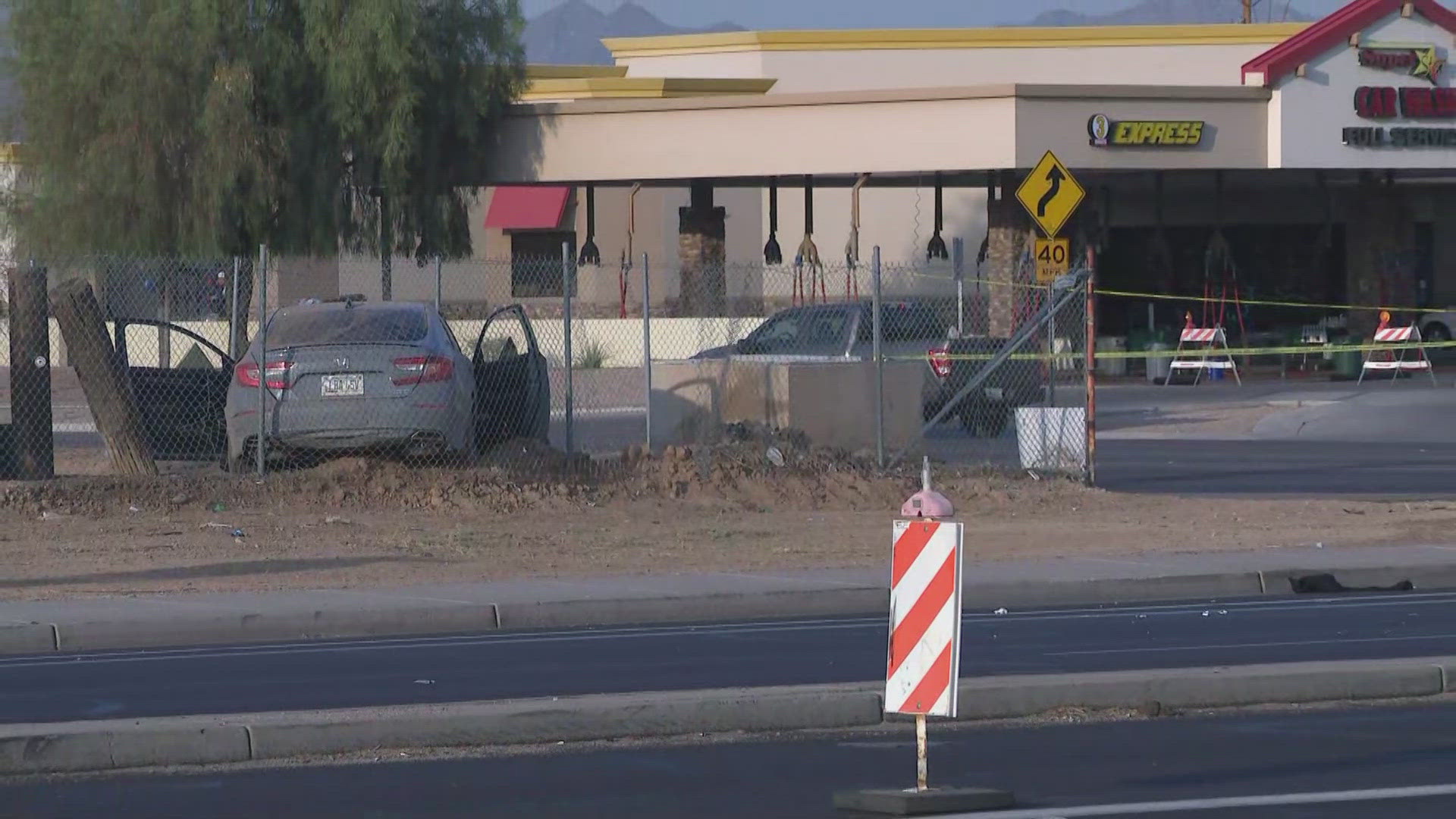 A woman was found dead inside a crashed car near 19th Avenue and Baseline Road in Phoenix.