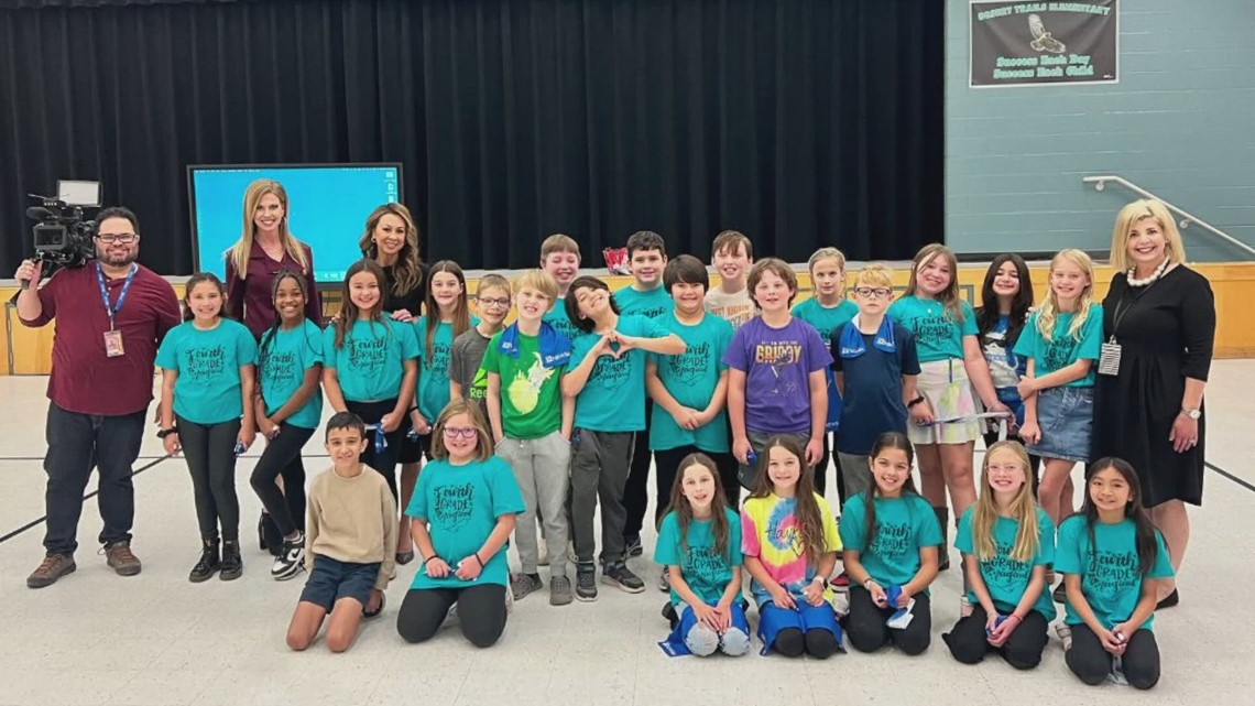 Krystle Henderson and Tram Mai visit with students from Desert Trails Elementary