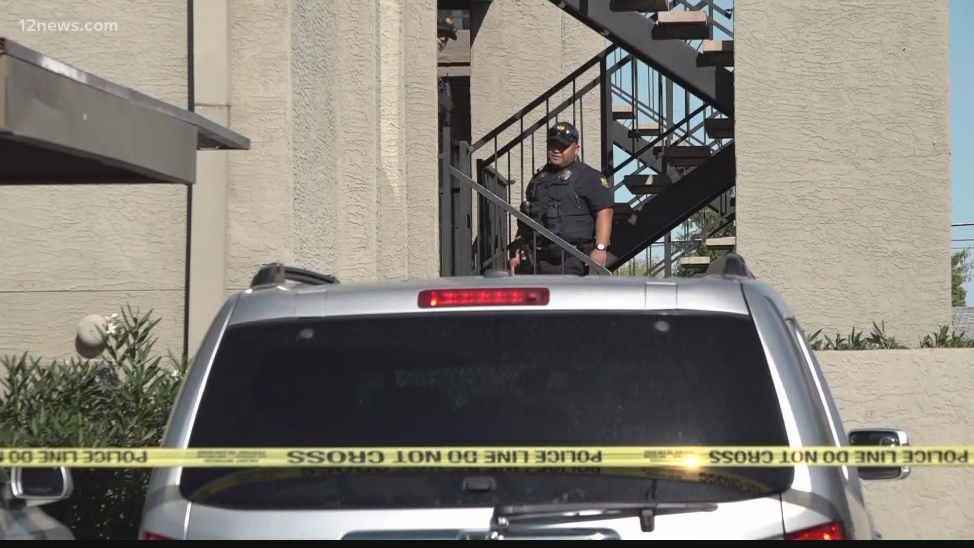 A suspect has been taken into police custody after a 33-year-old man died during a residential fire Saturday afternoon at an apartment complex in West Phoenix.