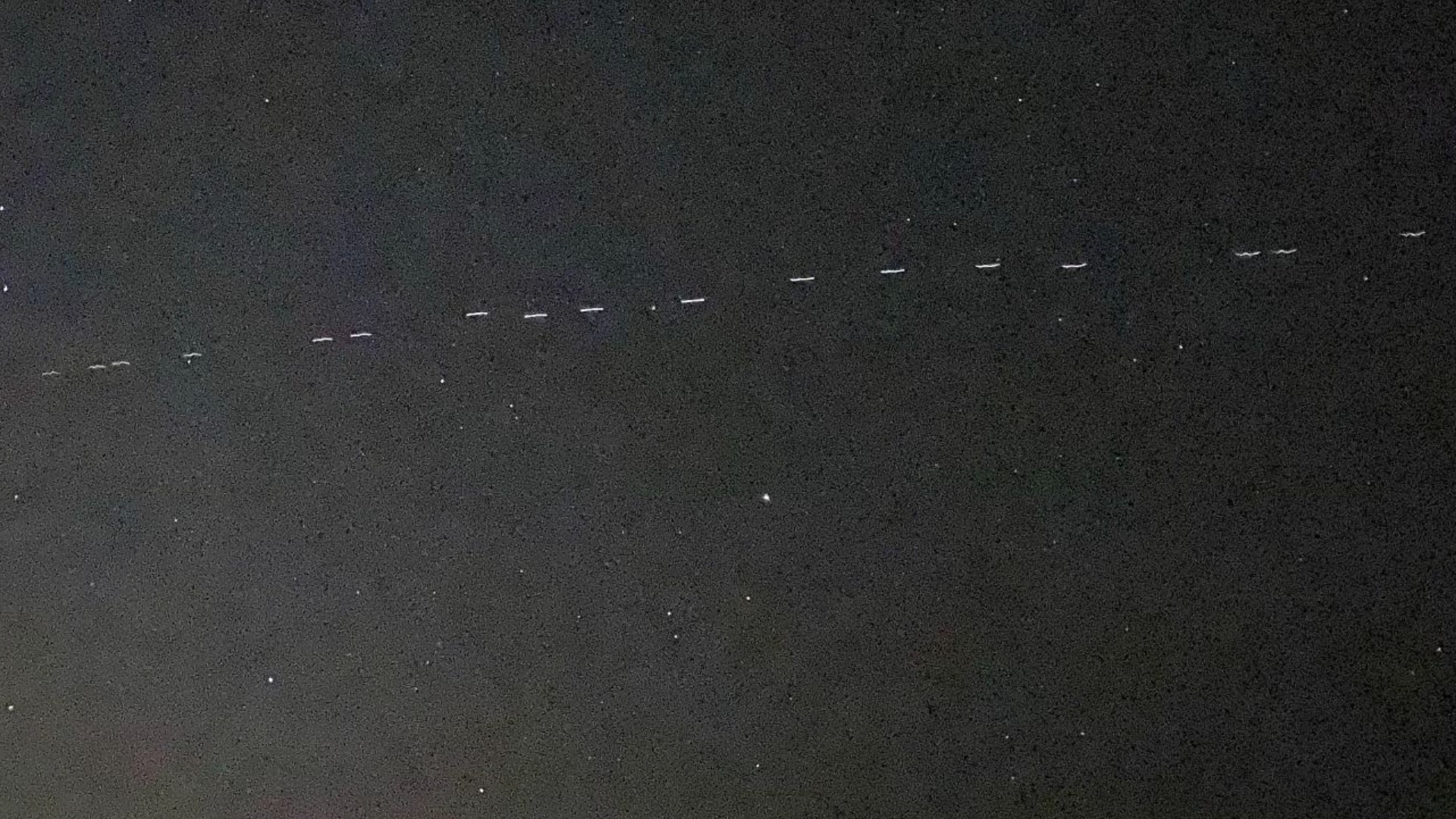 Look up at night and you may witness an array of lights streaking above the sky in perfect formation. It's not aliens, though. It's satellites from SpaceX.