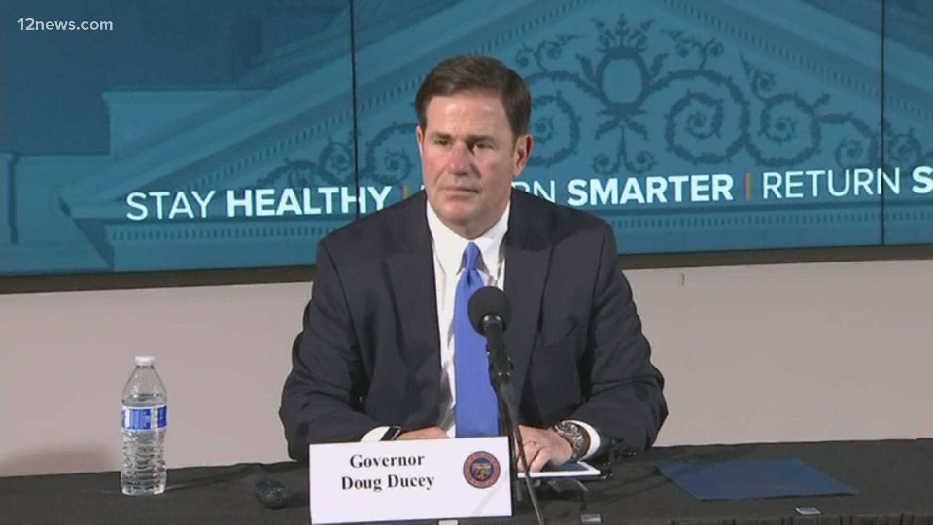 Gov. Ducey likes to say his decisions are data-driven. But he appeared to ignore the data on a huge screen right behind him at a news conference on Thursday.