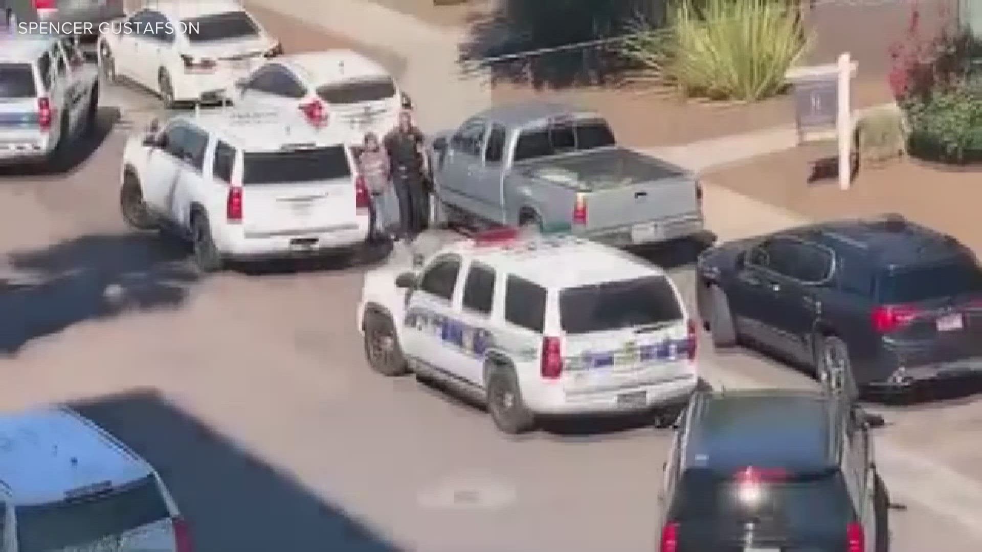 Video from Spencer G. shows a woman in handcuffs after a shooting in downtown Phoenix Tuesday. Police say they arrested a man and a woman.