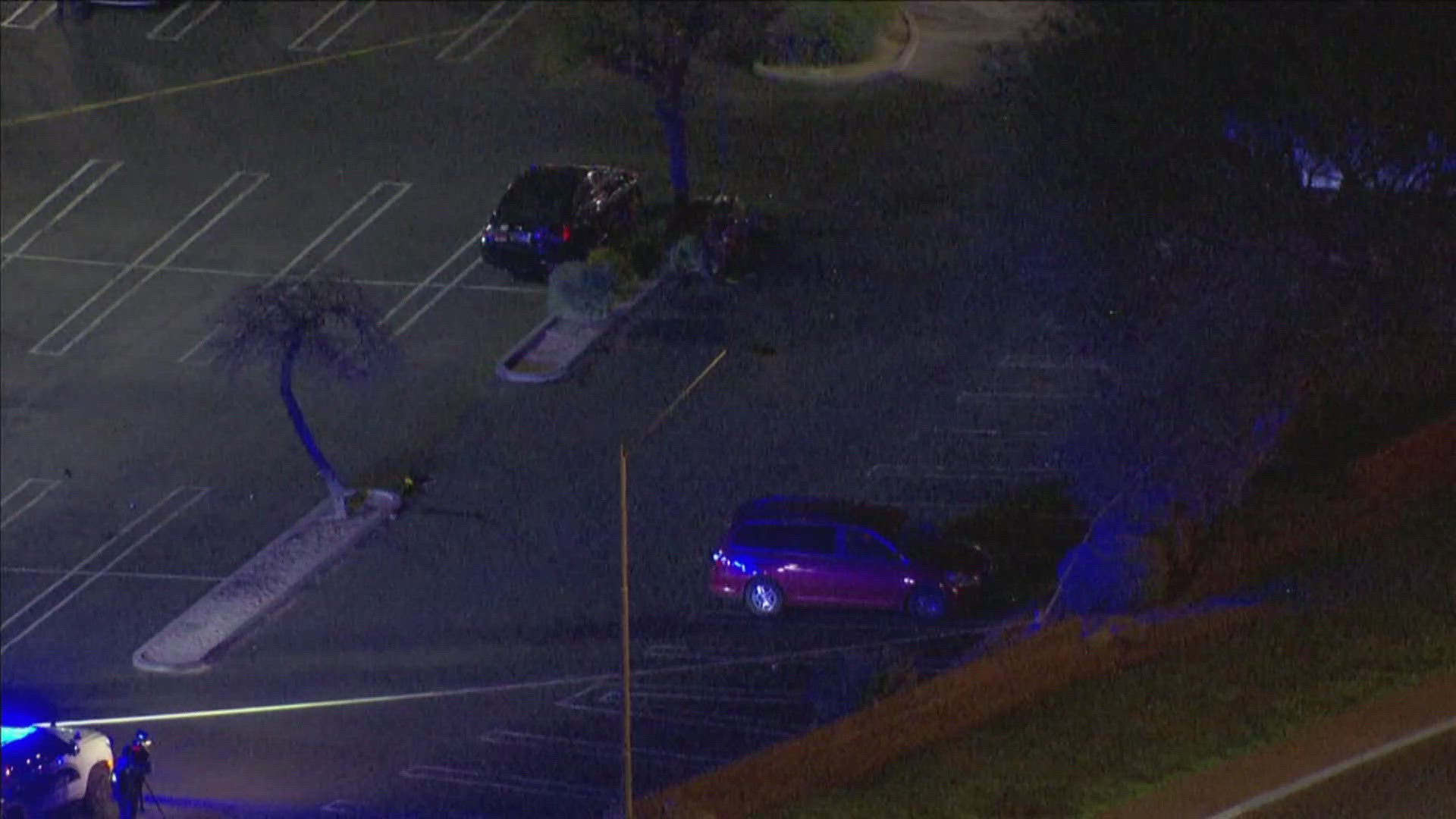 Footage from Sky12 shows a large police presence on the scene with an area near the entrance to the parking lot blocked off.