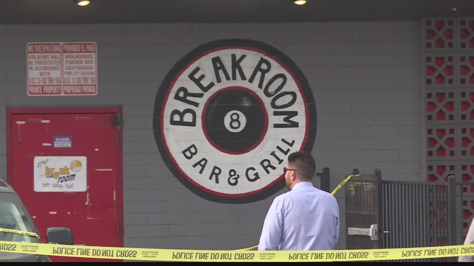Two men are dead and one is in custody following a shooting at a bar in central Phoenix.