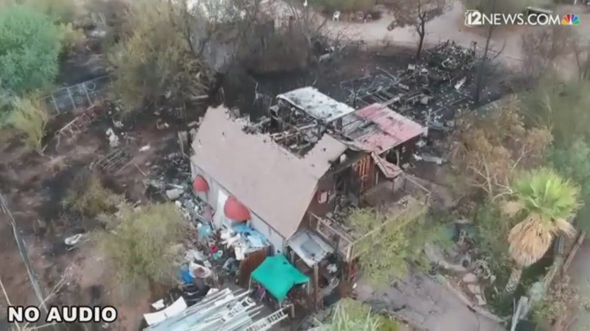 Aerial footage shows the damage to a structure and the surrounding area after a fire in Cave Creek on Thursday evening.