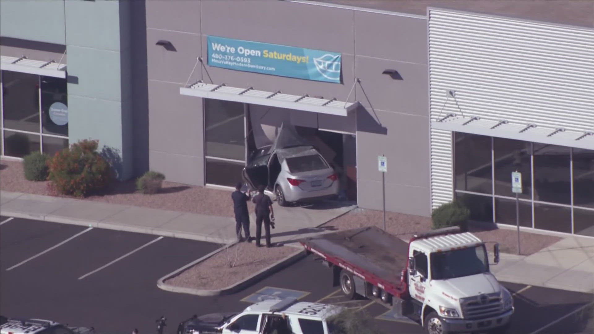 No injuries were reported after a car crashed into a Mesa building on Tuesday afternoon, according to the city's police department.