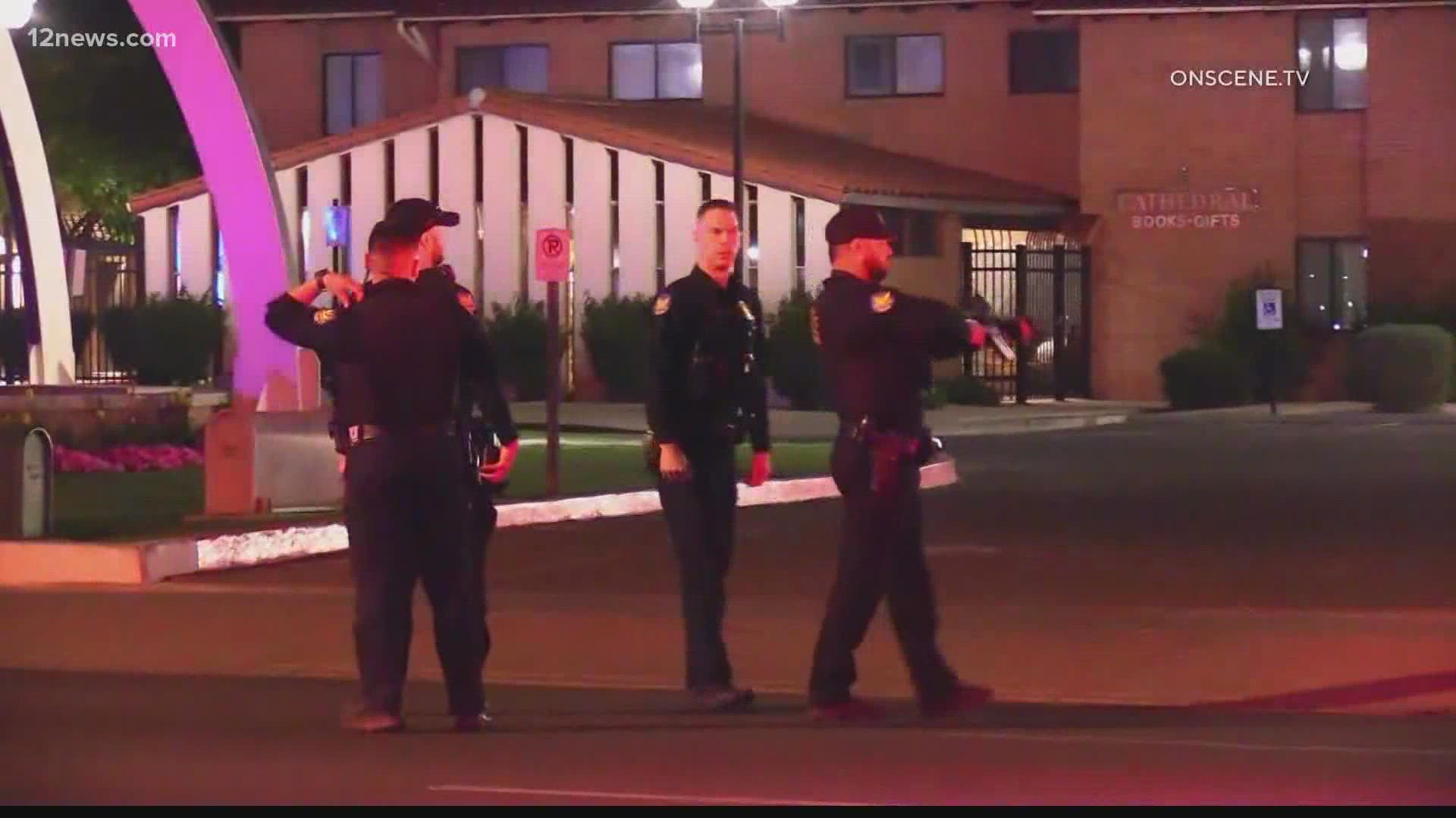 A man was arrested Sunday night for allegedly shooting at two Phoenix police officers in "ambush" style. One of the officers was shot in the wrist and is  recovering