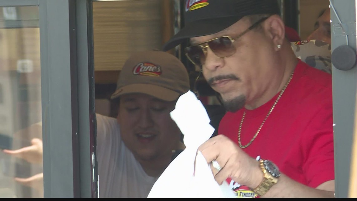 IceT hands out iced tea to fans at Raising Cane's location in the