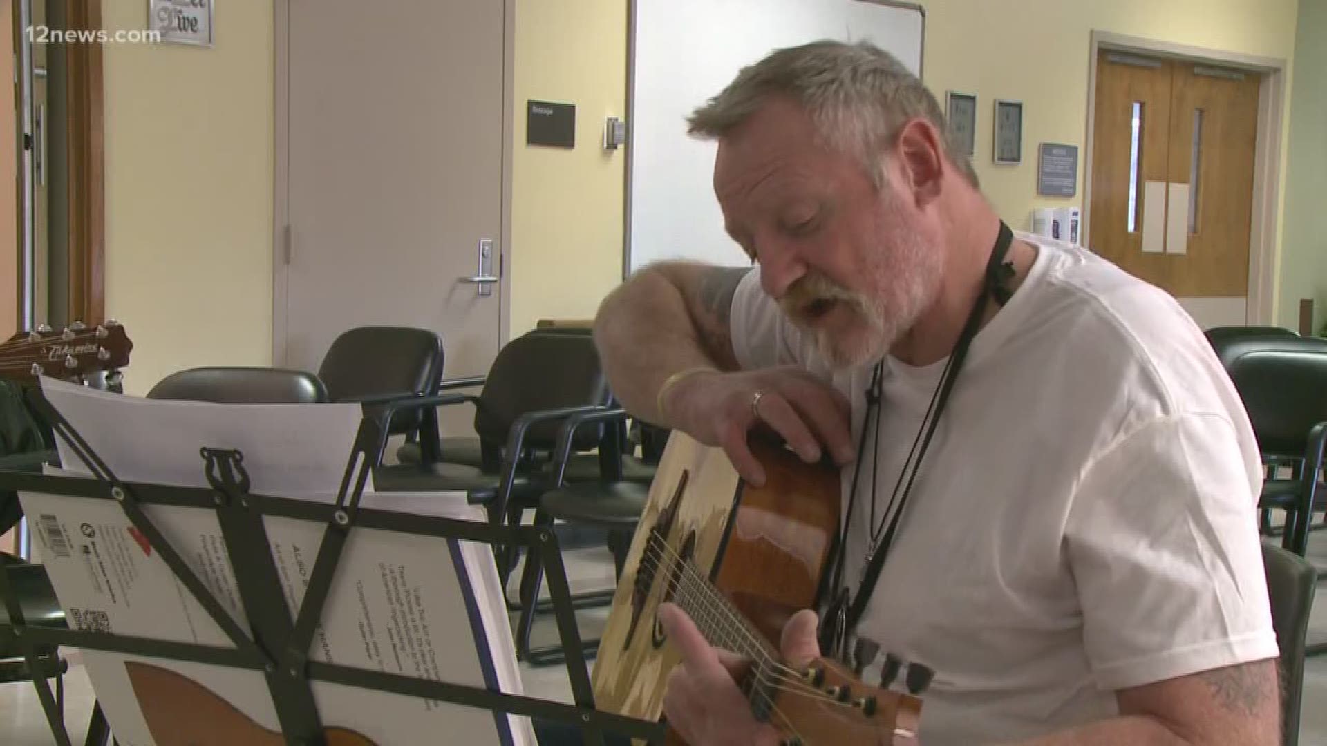 A group of men in Prescott is finding solace in learning to play the guitar.