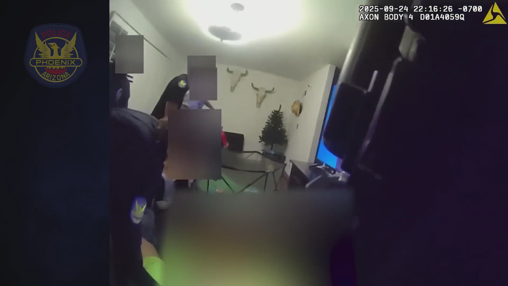 The Phoenix Police Department has released a new video showing the moment officers shot a man who was holding a toddler hostage with a machete. 
