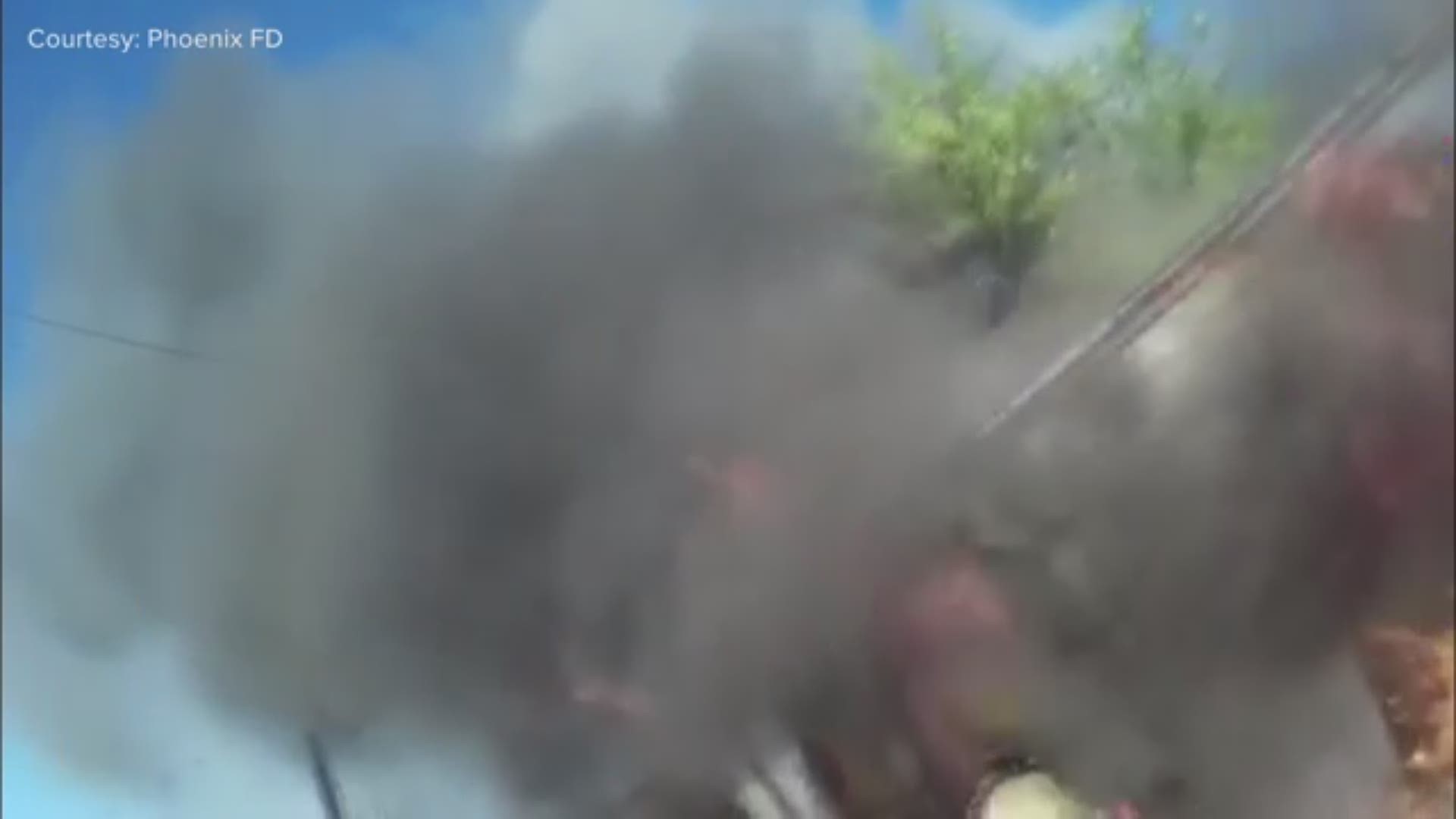 The helmet cam of a Phoenix Fire captain captured a heated moment as crews battled a mobile home fire Sunday.