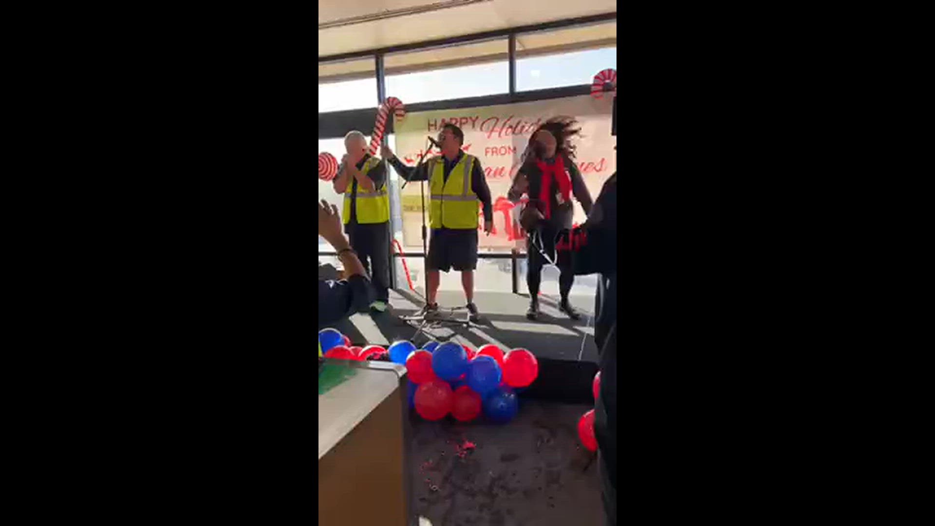 American airlines crew members singing and entertaining fliers at airport today
Credit: Darlene Carlson