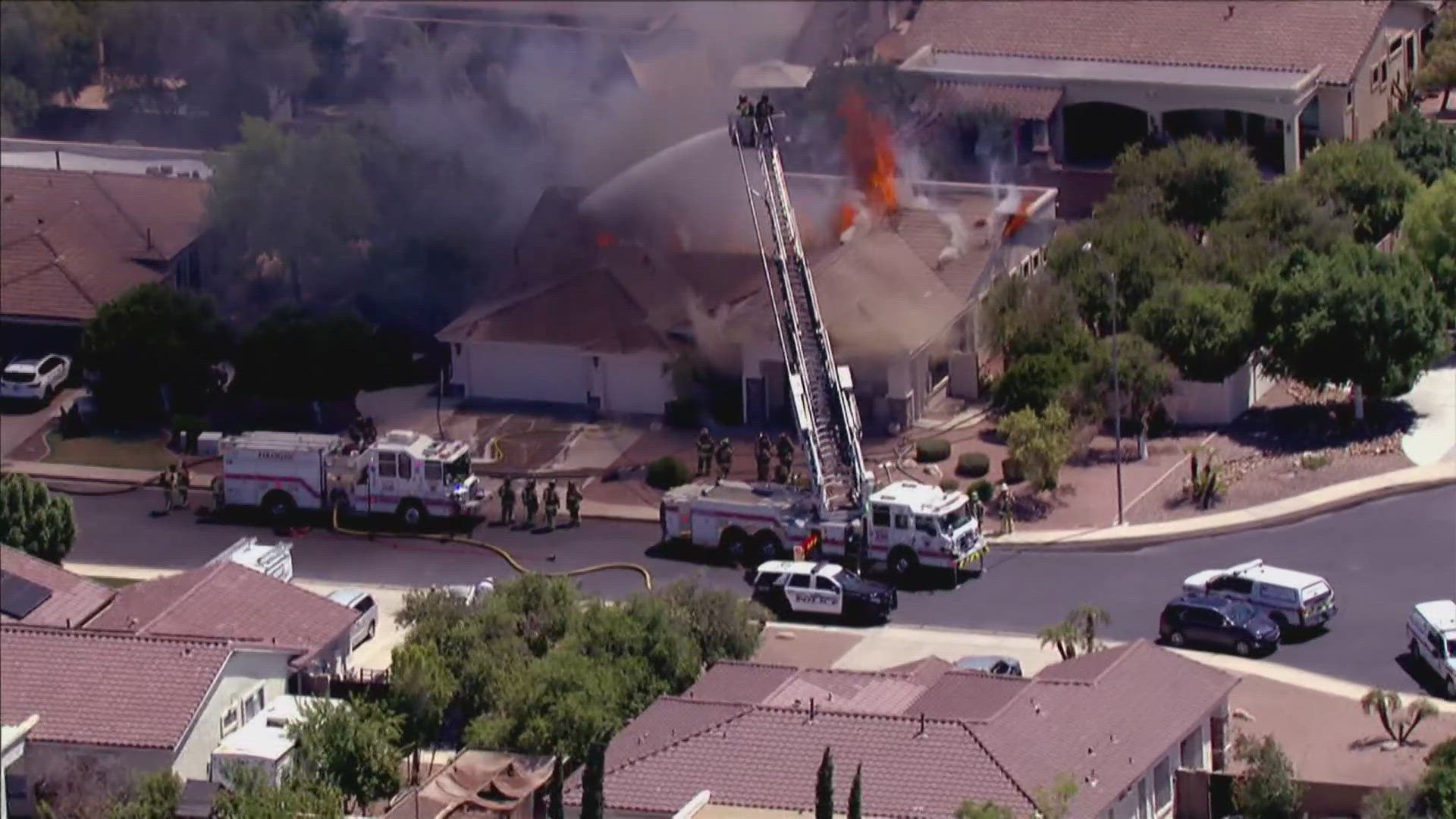 10 firefighters narrowly escaped a burning home as a roof collapsed on top of them.