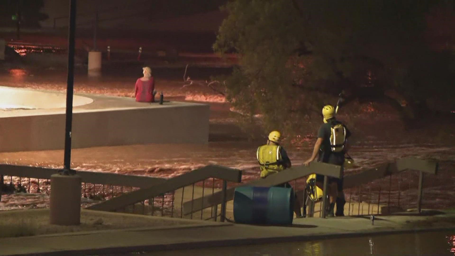 Crews are working to rescue a woman from a wash in a Scottsdale park.