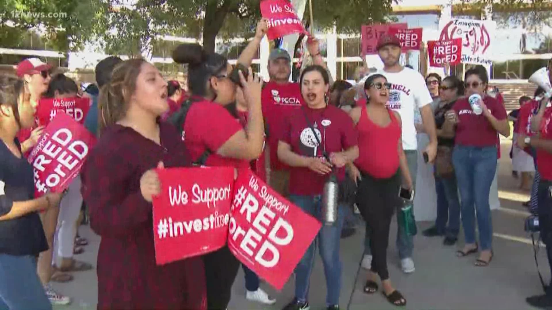 Teachers gather in protest of an Arizona Supreme Court ruling that removes an Invest in Ed ballot measure from the November election. Protesters say it is now more important than ever to elect the right people to positions of power to further their cause.