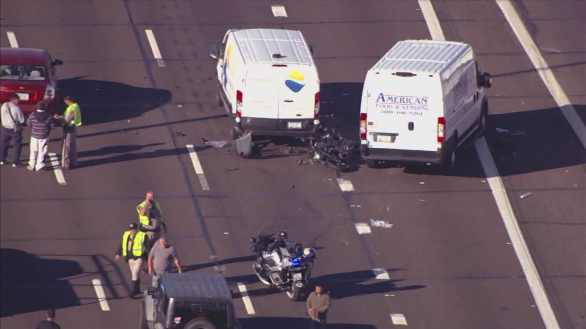 A motorcyclist died after being trapped beneath a van on a Phoenix highway on Tuesday morning, according to DPS.