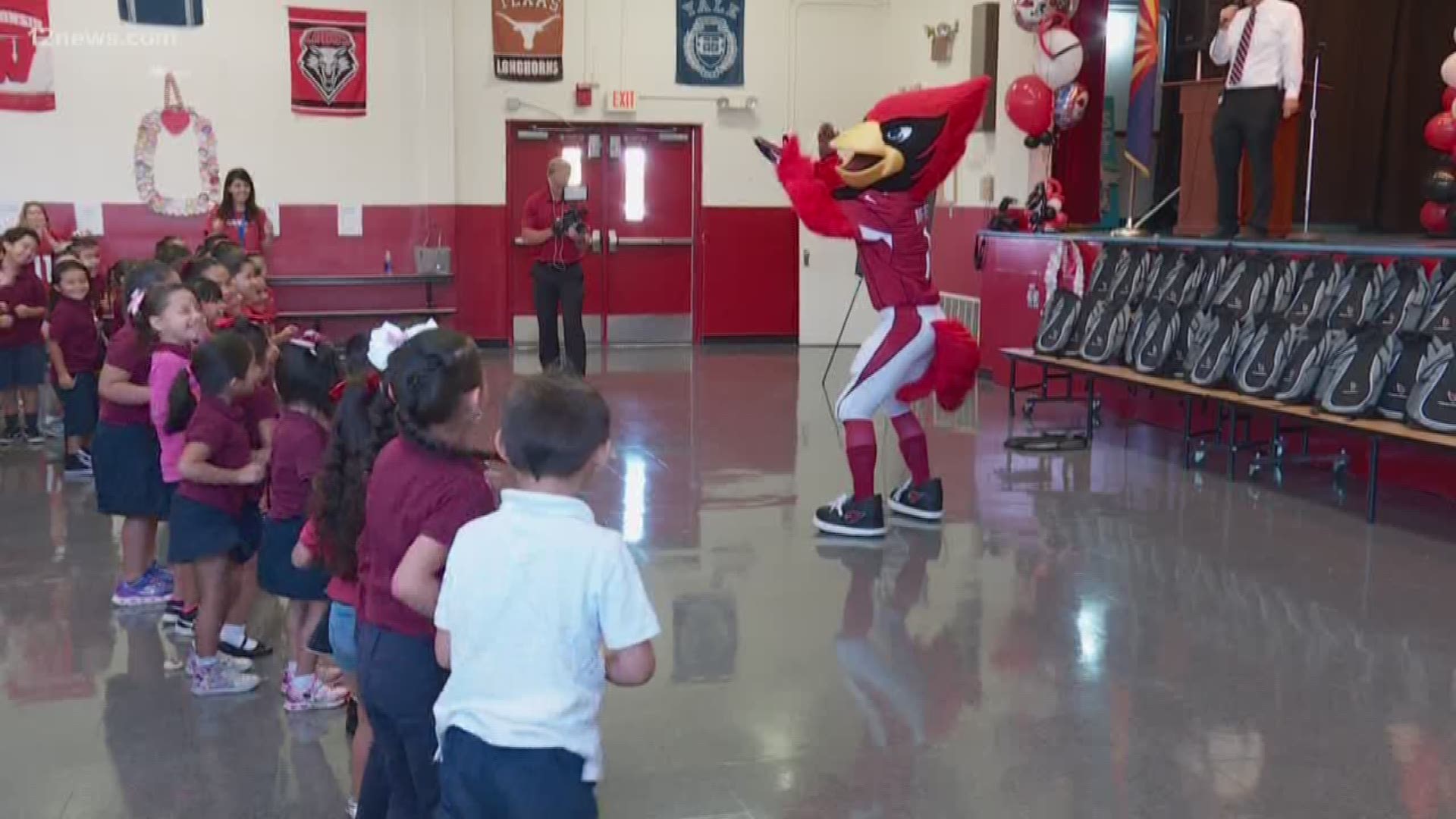 The Arizona Cardinals, along with Albertson's-Safeway and 12 News, paid a visit to J.B. Sutton Elementary School to give out Arizona Cardinals backpacks and give some much needed money for school supplies.