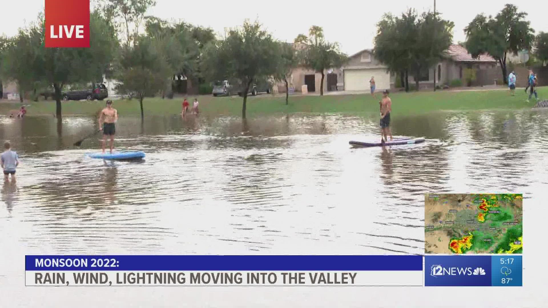 Heavy rainfall across the East Valley on Friday resulted in flooding at one park and residents got some use out of their paddleboards.