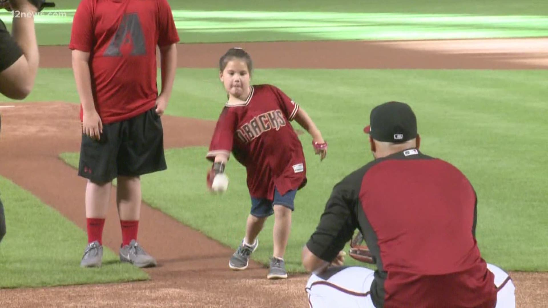 She's on a mission to throw the first pitch in all 30 major league ballparks.