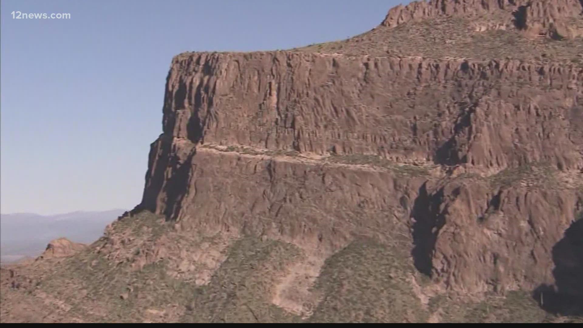 The Pinal County Sheriff's Office responded after a friend of a 21-year-old hiker called 911 saying the man had slipped while taking a photo.