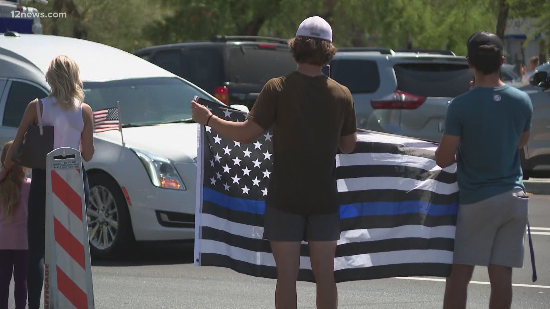Officer Christopher Farrar was killed last week after a suspect him with a car following a high-speed chase. A procession honoring Farrar was held on Friday.