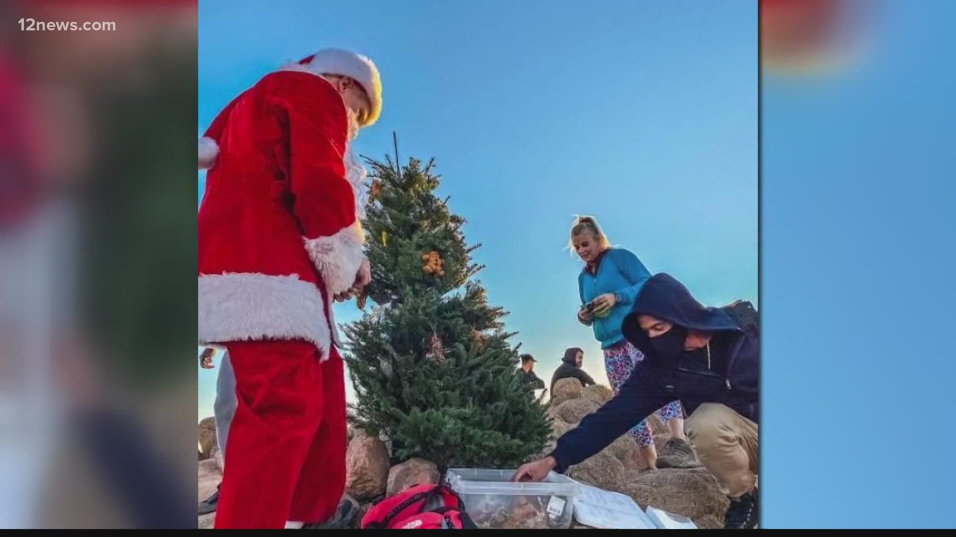 A Valley man makes his annual trek up Camelback Mountain to plant a christmas tree at the top in honor of first responders. Santa has made the hike since 2013.