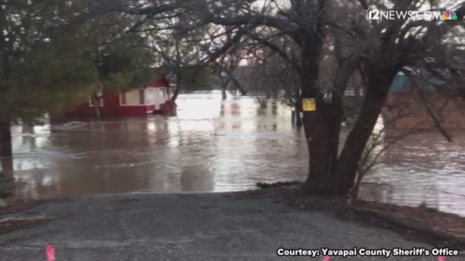 A street in Cottonwood, AZ is flooded after heavy rains Valentine's Day.