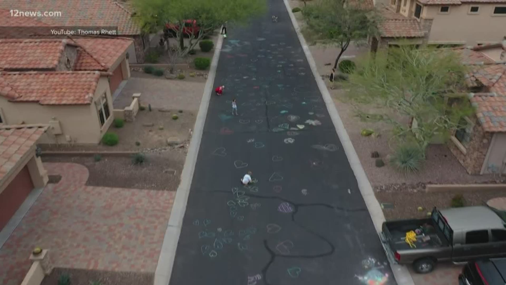 KaBrina And KaTasha Kringen showed their neighbors love by filling their street with chalk hearts.