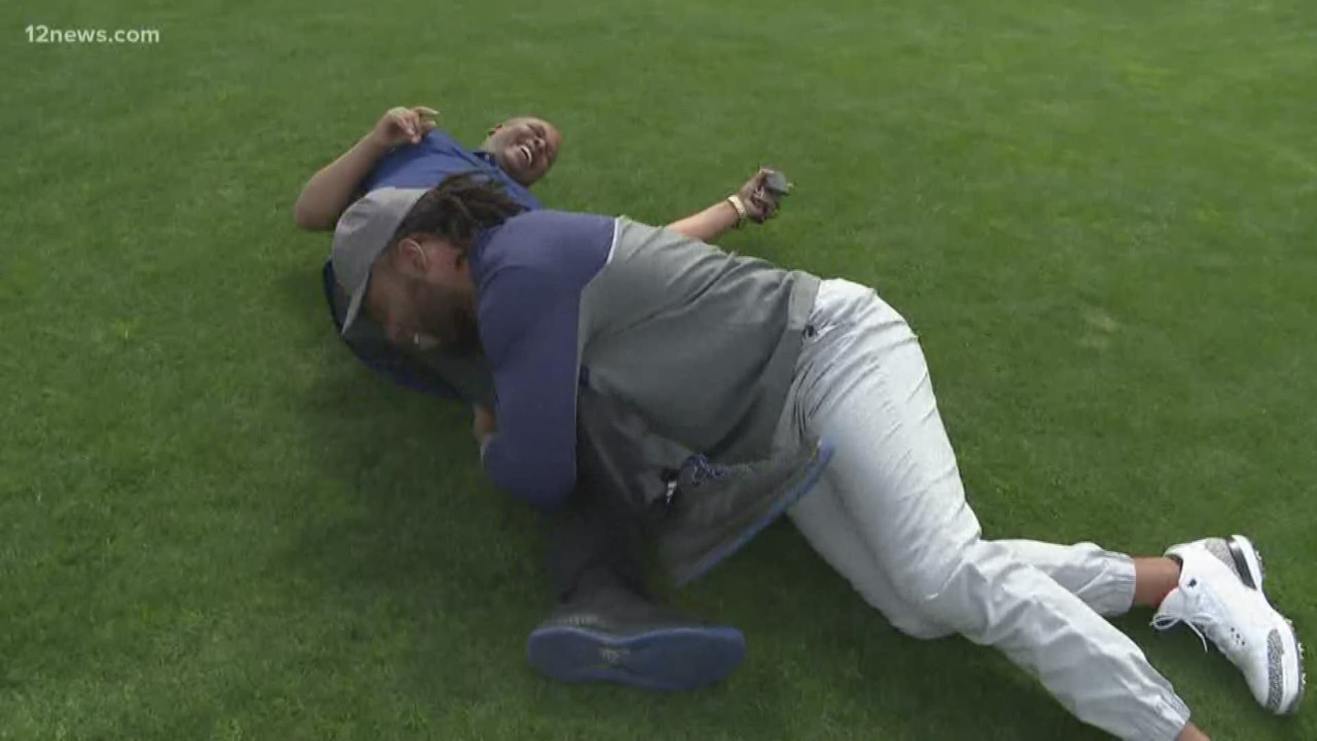 Bruce Cooper took a tumble down the 10th hole at the Waste Management Phoenix Open Wednesday. Cardinals player Larry Fitzgerald may have had something to with it!
