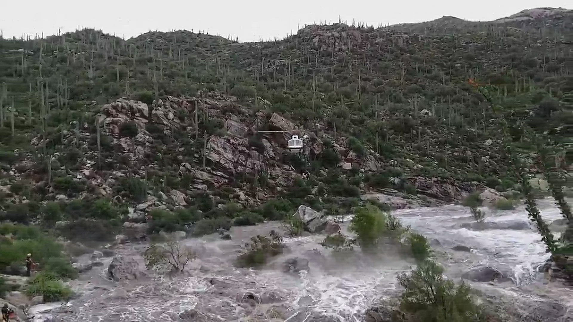 Flash flooding from monsoon storms in southeastern Arizona stranded 17 hikers in the Tanque Verde Falls area of Redington Pass Sunday (Video: Pima County Sheriff's Department).