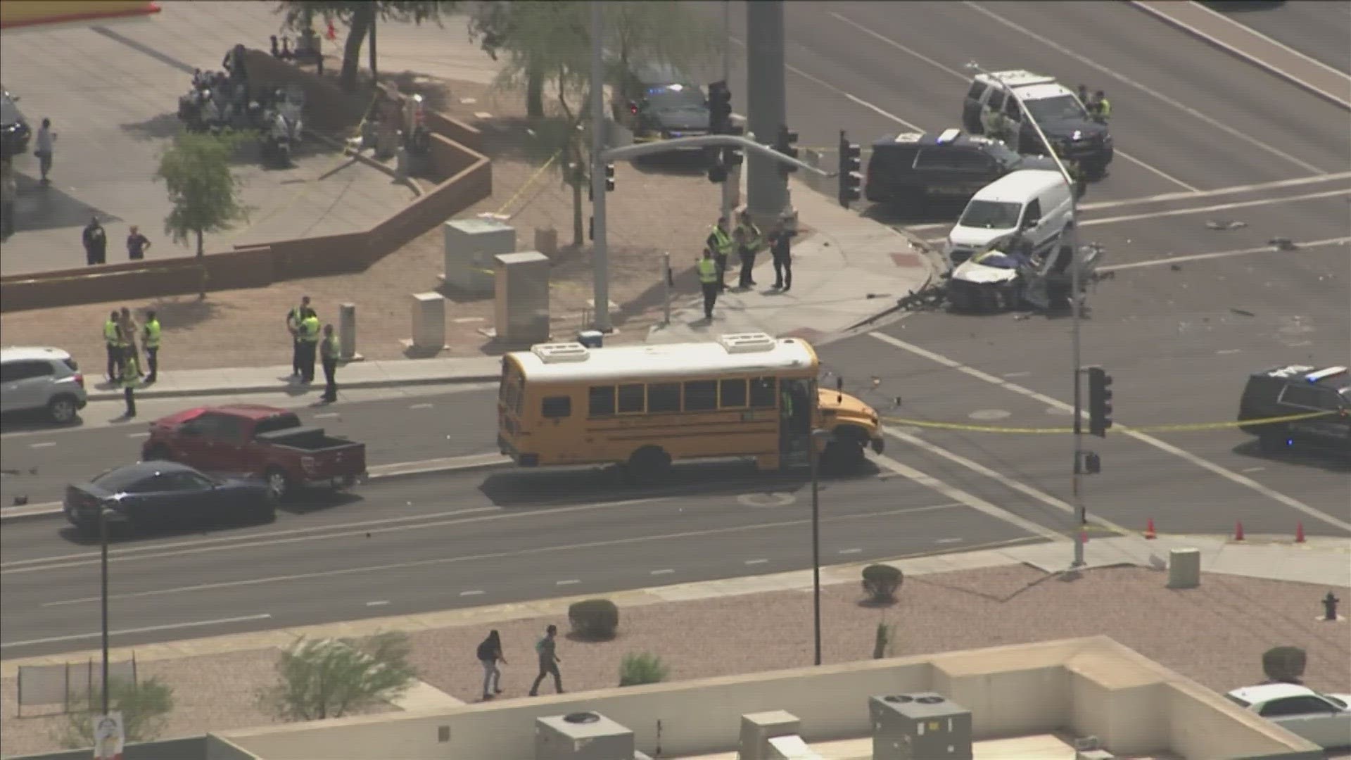 Mesa police said one person is dead after a collision Wednesday afternoon involving multiple vehicles and a school bus.